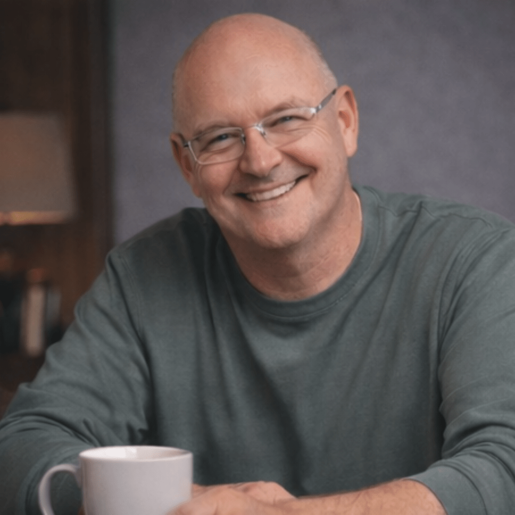 Rick Ollie smiling while reflecting and writing a letter to his 100-year-old self for a personal essay about life, resilience, and hope.